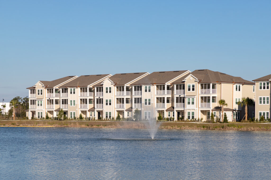 Altís Grand at the Preserve exterior shot of building by the lake