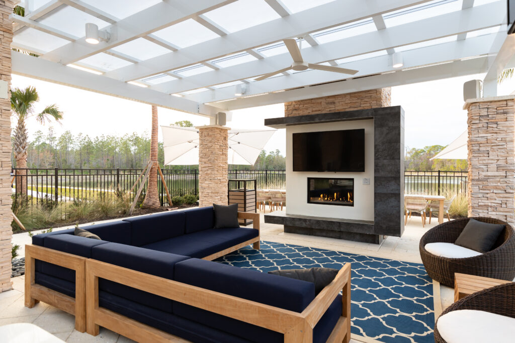 Altís Grand at the Preserve outdoor lounge area with tv and fireplace